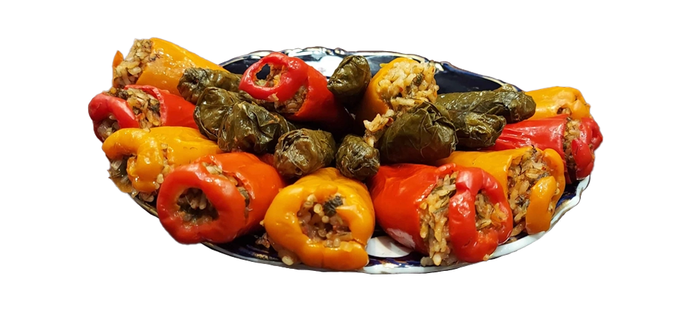 Plated rice and herb stuffed sweet pepper dolma.